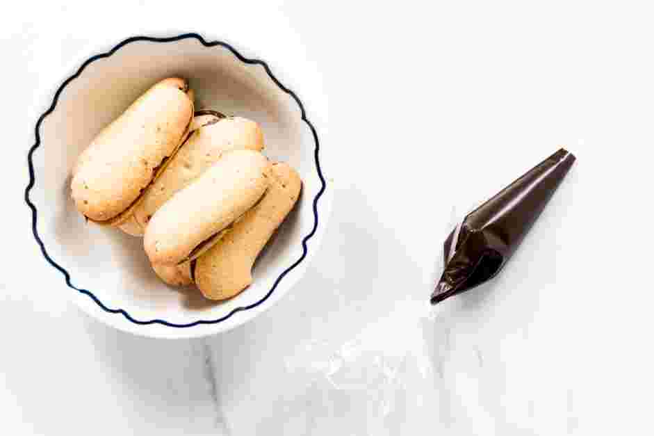 Dirt Cups Recipe: Transfer the melted chocolate to a small piping bag fitted with a small round tip.