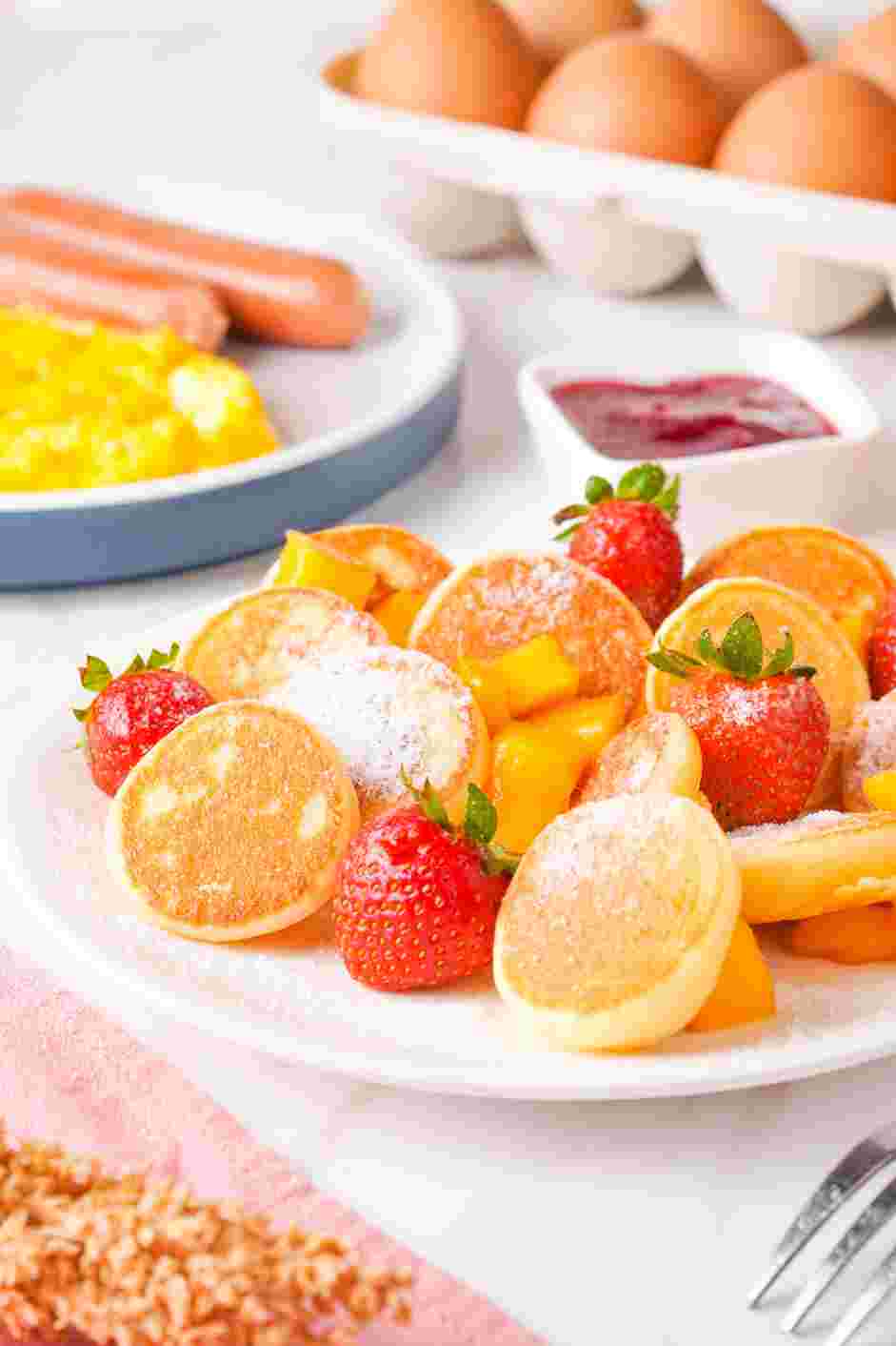 Mini Pancakes Recipe: Plate the mini pancakes with seasonal berries or your favorite fruit and sprinkle with powdered sugar on top.