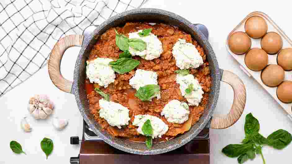 One Pot Lasagna Recipe: Add spoonfuls of the ricotta mixture to the pot with fresh basil.