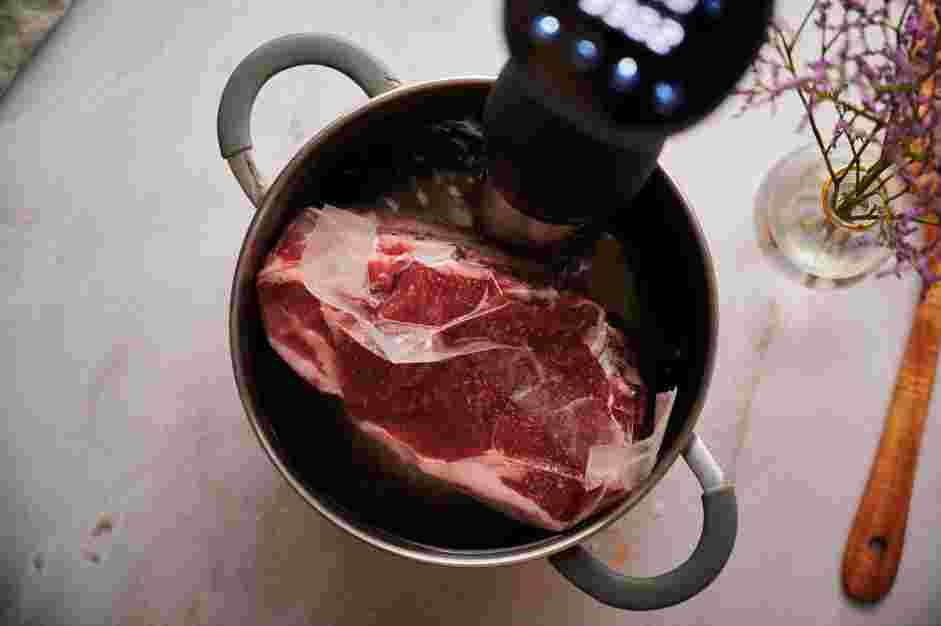 Sous Vide Prime Rib Recipe: Submerge the vacuum-sealed prime rib into the sous vide water bath.