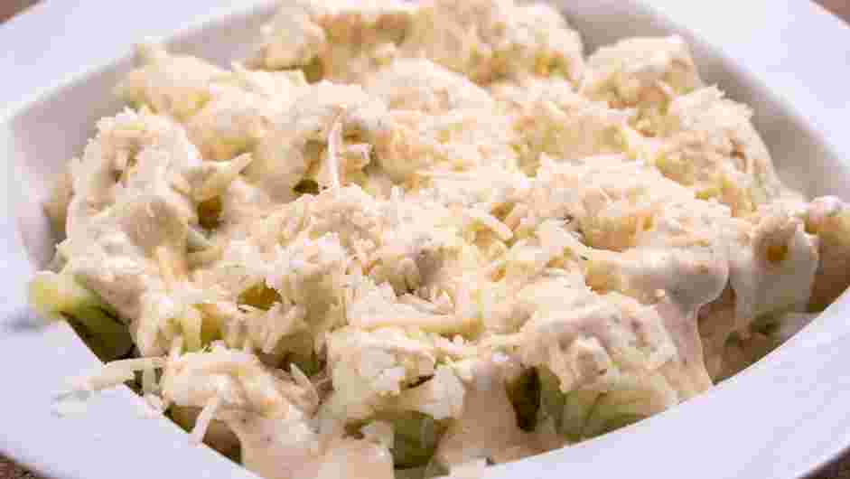 Cauliflower Au Gratin Recipe: In a 9-inch baking dish, arrange a layer of the steamed cauliflower.