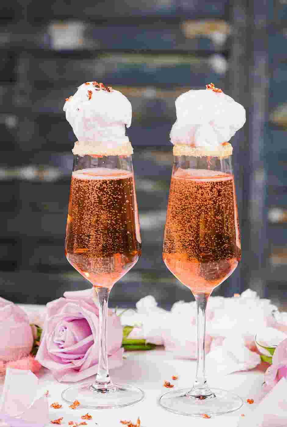 Cotton Candy Champagne Recipe: Place a fluffy cloud of cotton candy on top of the champagne rim.