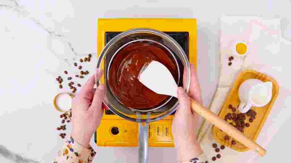 Chocolate Covered Espresso Beans Recipe: Prepare a double boiler by filling a small saucepan with an inch of water.