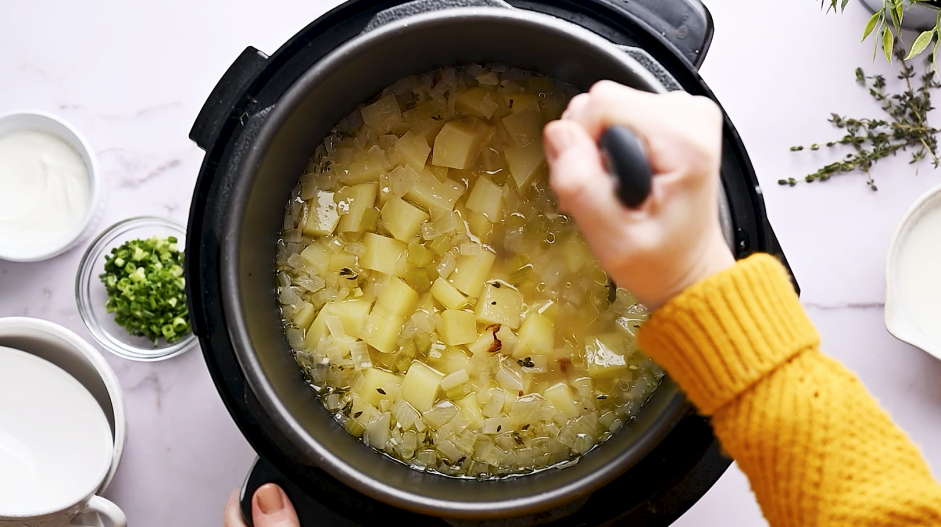 Instant Pot Potato Soup Recipe: Remove the lid and use a potato masher to lightly mash some of the potatoes.