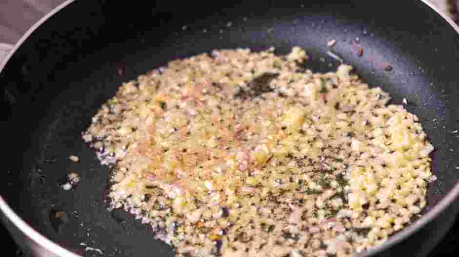 Creamy Shrimp Scampi Recipe: In a sauté pan, place the minced garlic, shallots and light olive oil.