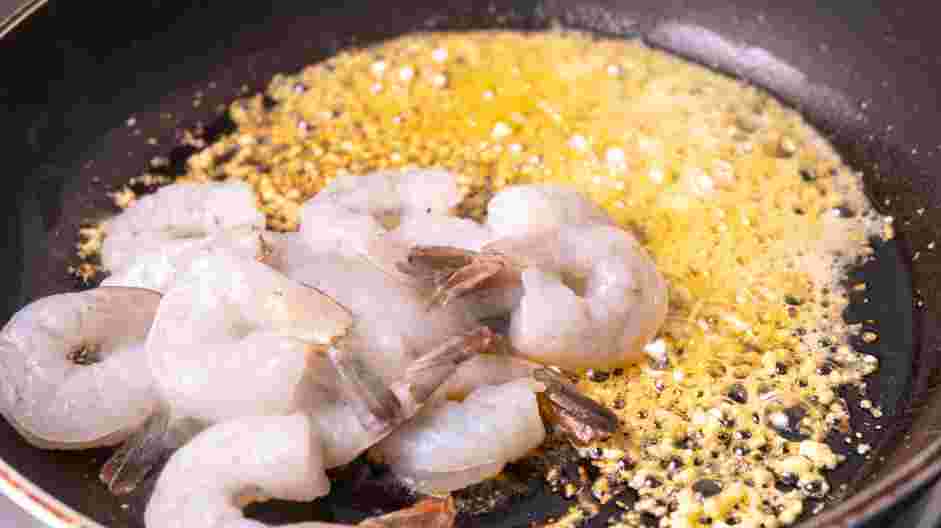 Creamy Shrimp Scampi Recipe: Add the shrimp, making sure it is coated in the garlic and red pepper flakes.