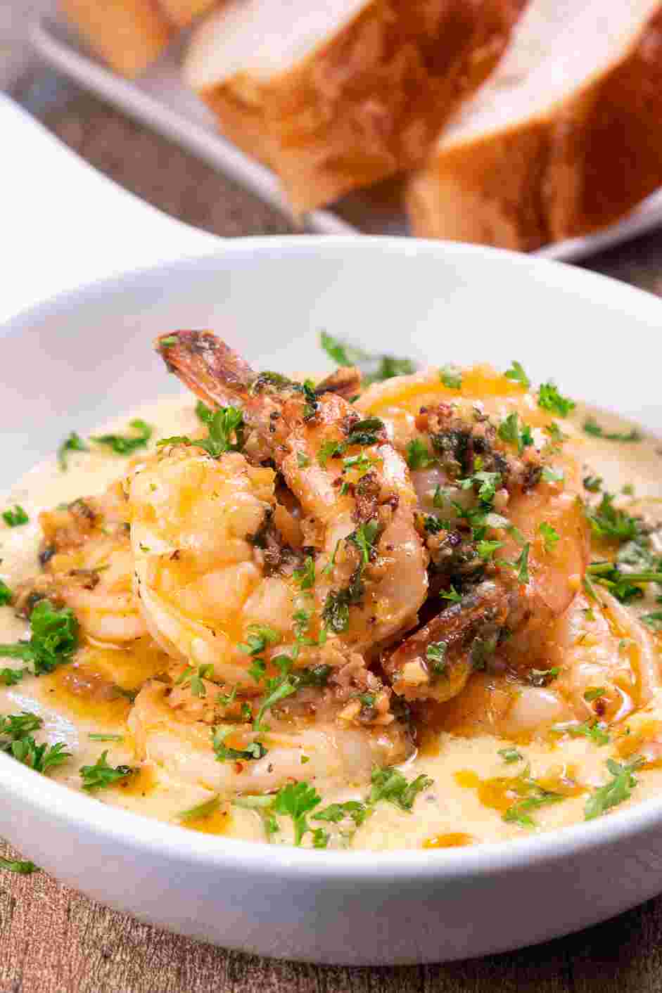 Creamy Shrimp Scampi Recipe: Plate the paesano sauce and place the shrimp scampi on top of the sauce.