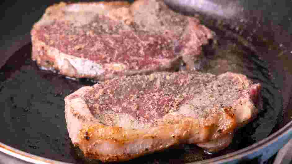 Garlic Butter Steak and Skillet Potatoes Recipe: In a sauté pan over high heat, heat the olive oil.