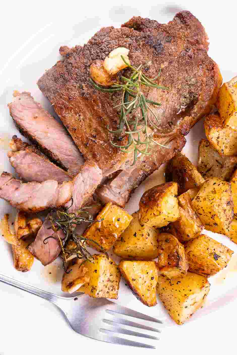 Garlic Butter Steak and Skillet Potatoes Recipe: Plate the potatoes with the steaks.