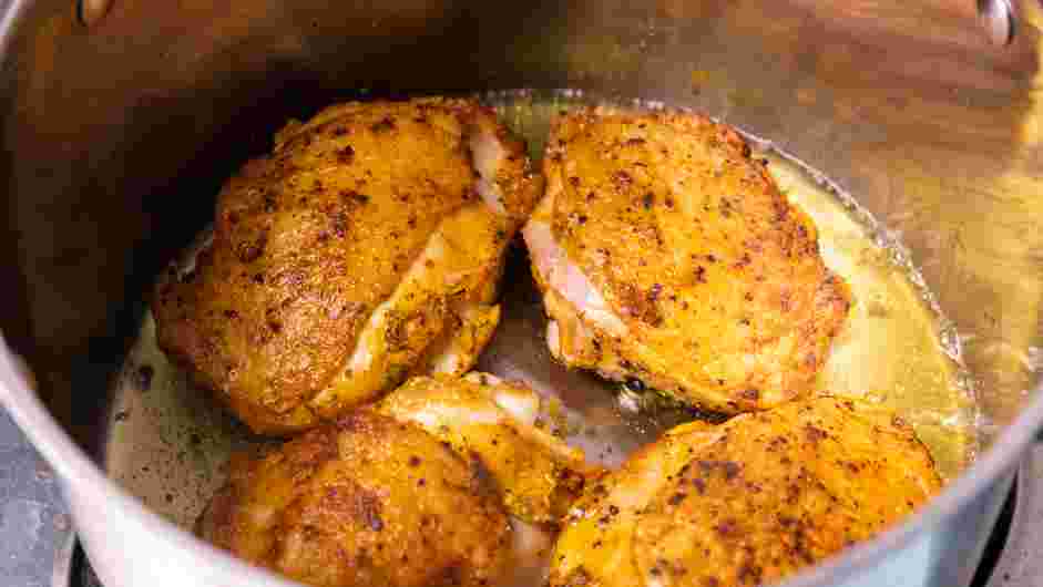 Pan Seared Chicken Thighs with Rice Recipe: In a large pot over medium heat, place two tablespoons of the oil.