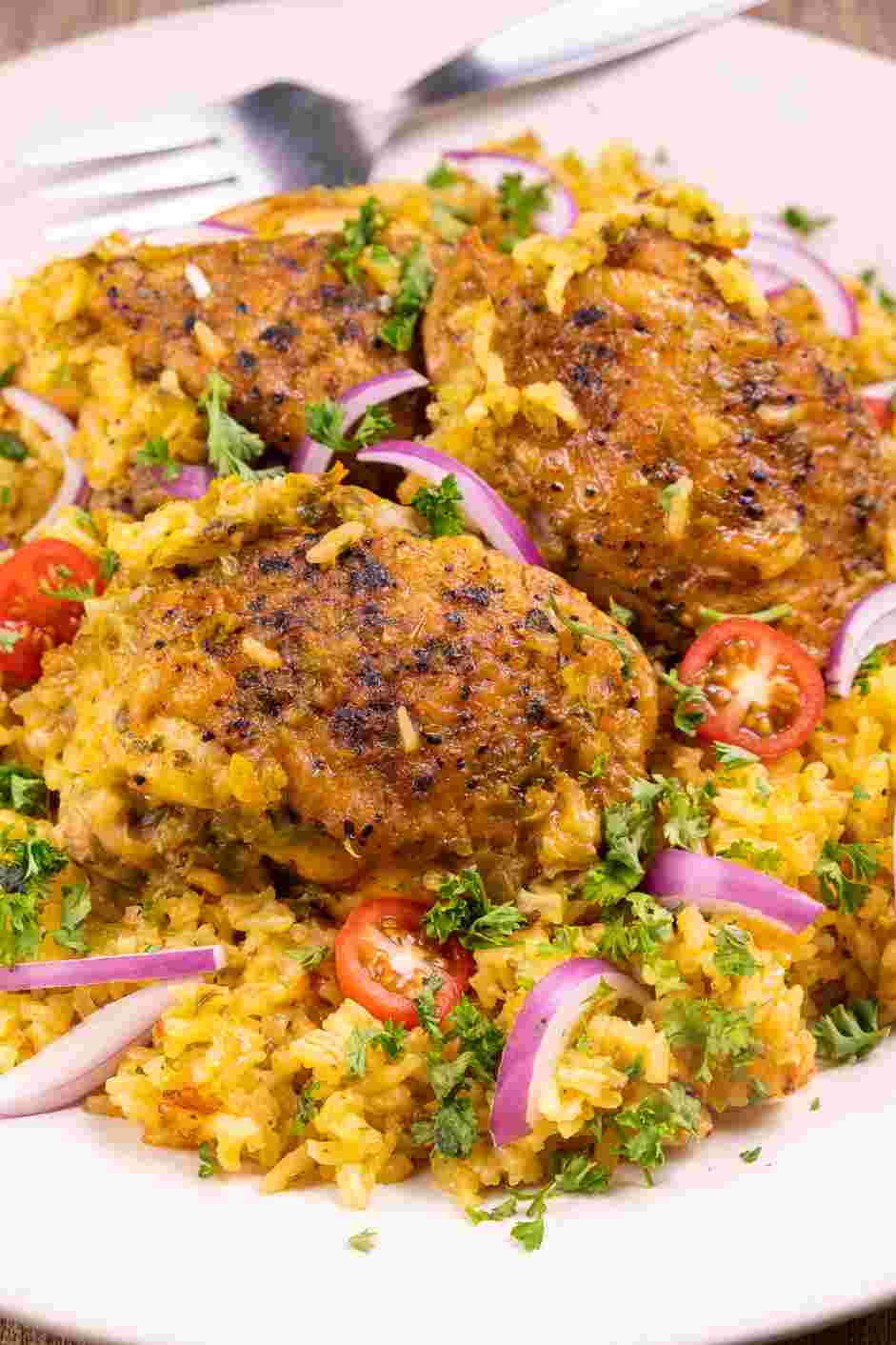 Pan Seared Chicken Thighs with Rice Recipe: Serve with an iceberg tomato salad with a squeeze of lemon.