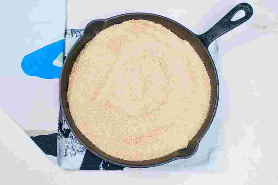 Smores Dip Recipe: Crush enough graham crackers to cover the cast iron pan.