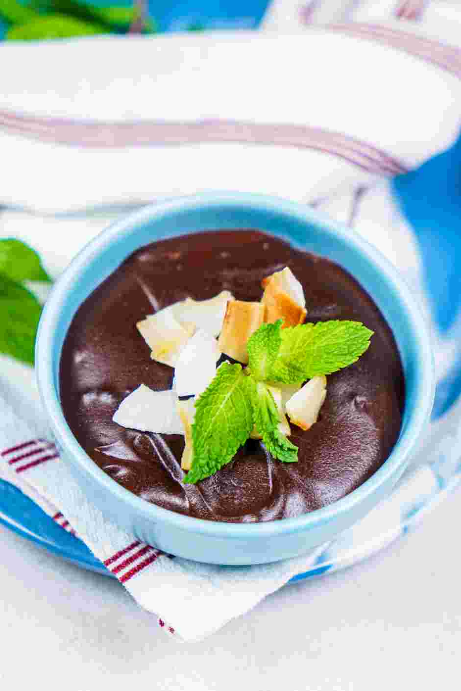 Vegan Chocolate Pudding Recipe: Once the pudding is thoroughly chilled, sprinkle with toasted coconut and garnish with a sprig of mint.