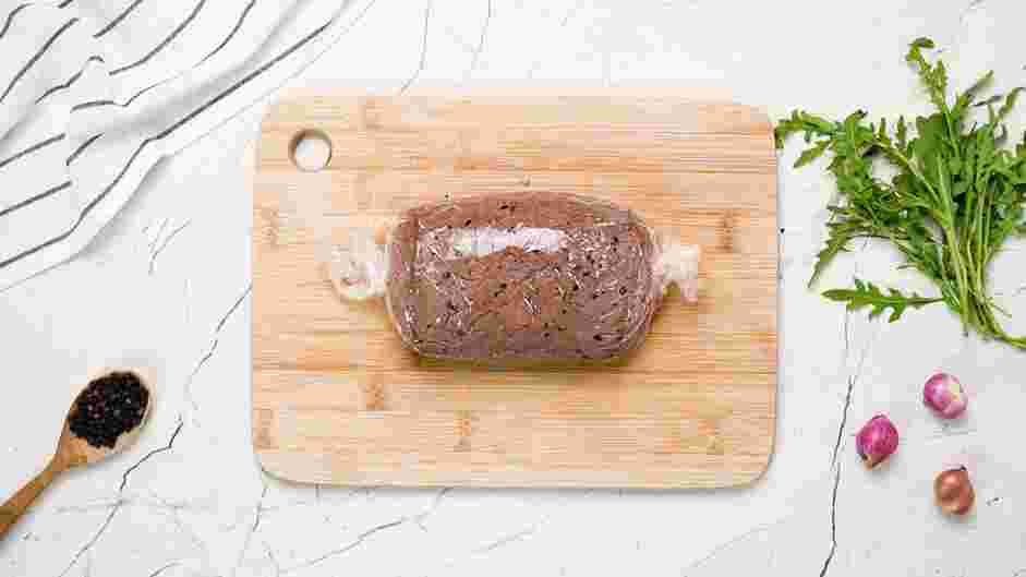 Beef Carpaccio Recipe: Wrap the seared beef tenderloin tightly in plastic wrap and twist on both ends to form an even cylindrical shape.