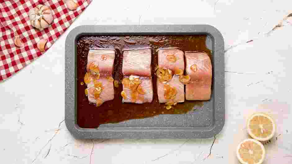 Grilled Mahi Mahi Recipe: Place the mahi mahi fillets on a baking pan or a bowl and add 90% of the sauce.