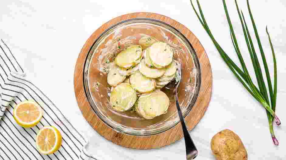 Grilled Potatoes Recipe: Toss the potatoes with the dressing and set them aside.