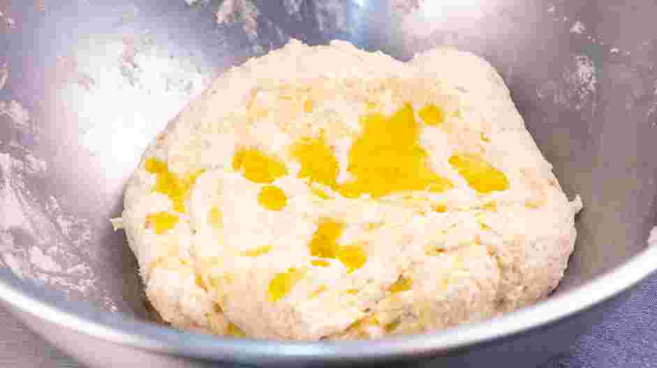 Focaccia Recipe: Once a dough forms, slowly add the extra-virgin olive oil with the mixer running.