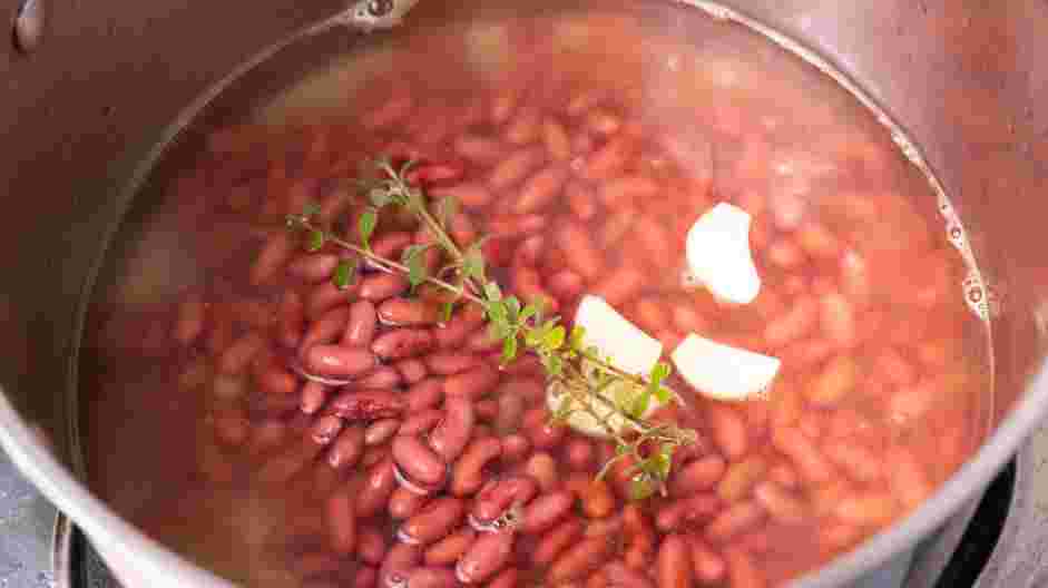 Jamaican Rice and Beans Recipe: Drain the beans and place them in a large pot.