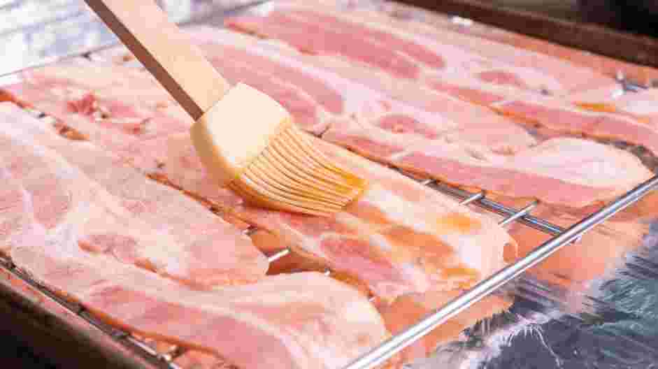 Maple Bacon Recipe: Place the bacon on the wire rack and lightly glaze one side of the bacon with the maple syrup mixture.