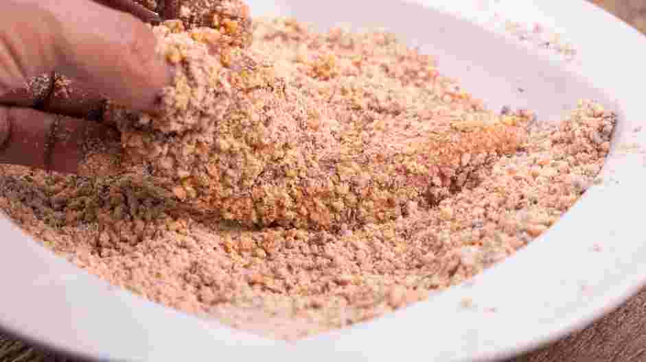 Pecan Crusted Chicken Recipe: Transfer the chicken tenderloin into the pecan mixture and press the pecan mixture into the chicken tenderloin to cover it.