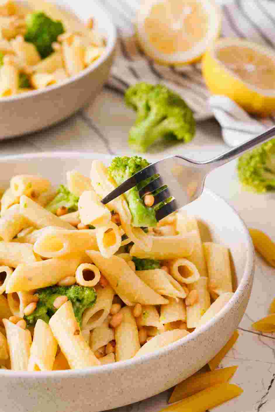 Broccoli Pasta Recipe: When everything is evenly coated in the cheese and butter, place in a serving dish, sprinkle with the pine nuts and serve.