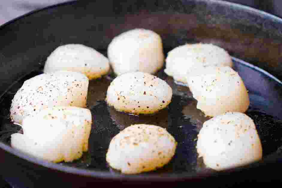 How to Cook Scallops Step 4: In a heavy duty or cast iron skillet over medium-high heat, add the olive oil.