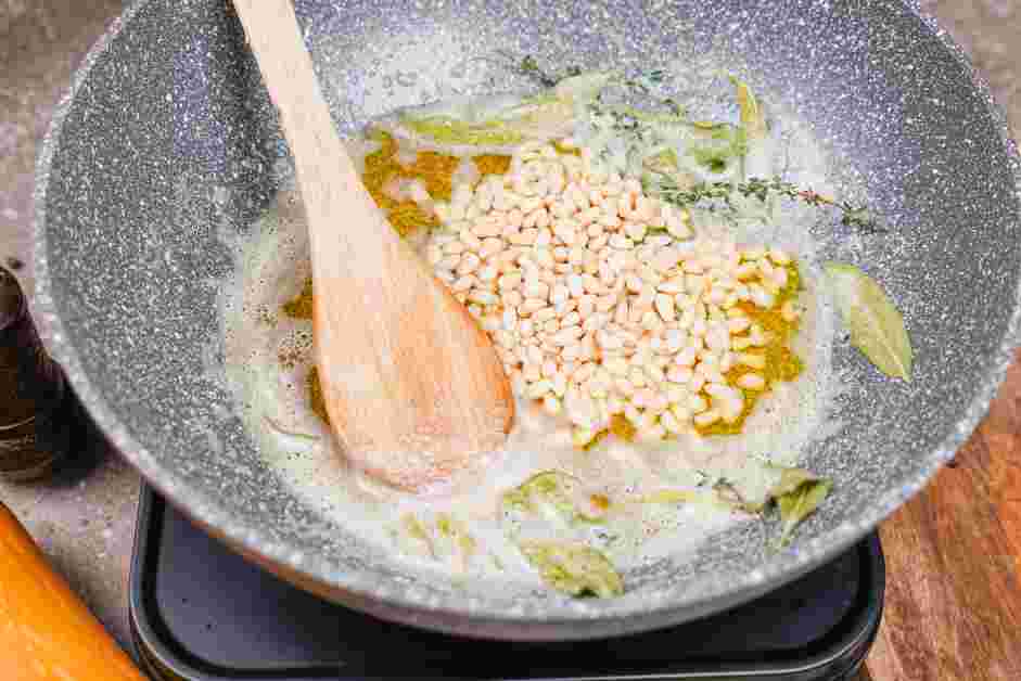 Butternut Squash Ravioli Sauce Recipe: Once the butter starts to form small browned bits of butter, add the pine nuts.