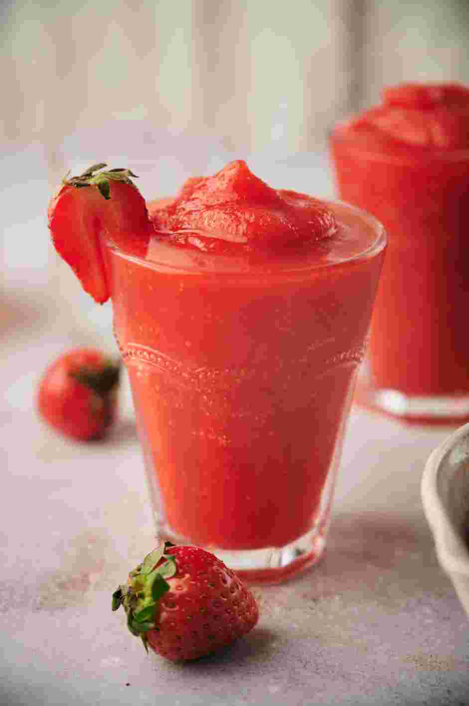 Frose Recipe: Serve in glasses garnished with a strawberry.