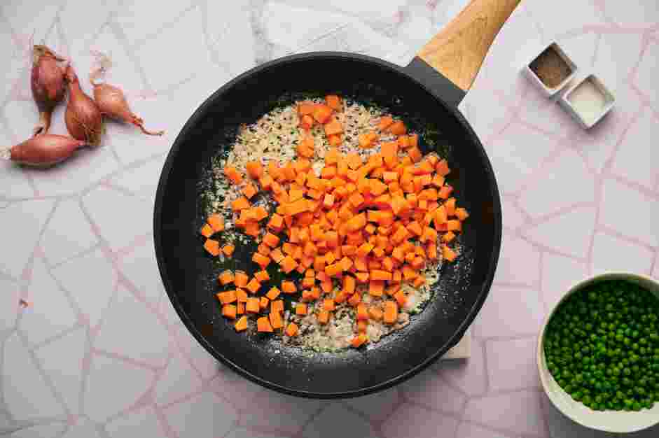 Peas and Carrots Recipe: Add the diced carrots and the broth (or stock) to the skillet.