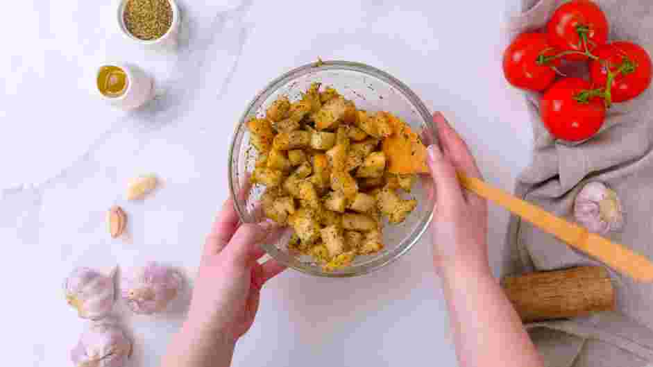 Grilled Chicken Caesar Salad Recipe: Place the chopped French bread in a bowl.