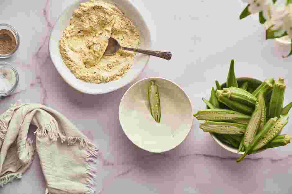 Air Fried Okra Recipe: Place the sliced okra into the buttermilk, tossing to coat evenly.