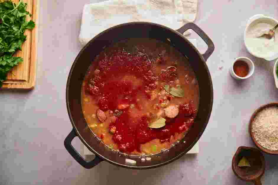 Shrimp Jambalaya Recipe: Stir in the minced garlic, dried oregano, bay leaves, marinara sauce, chicken (or vegetable) stock, hot sauce and long grain rice.