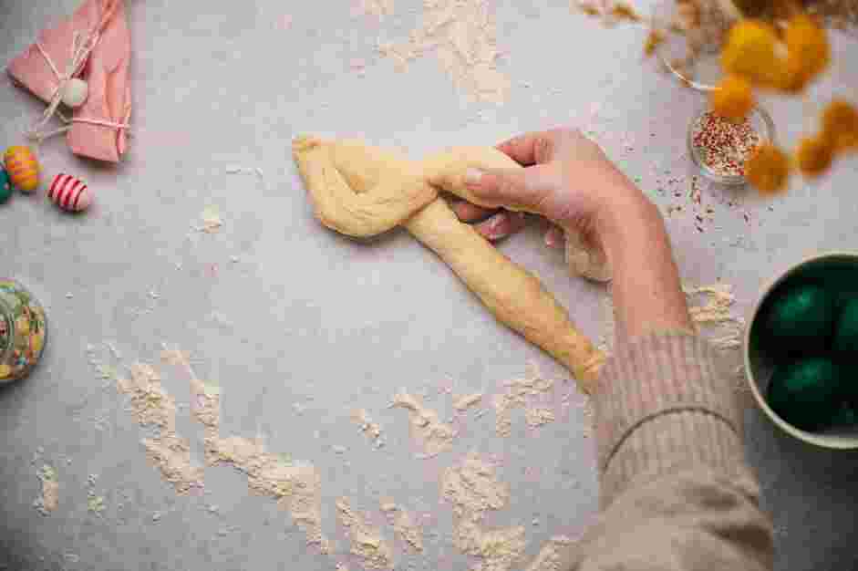 Italian Easter Bread Recipe: Take two pieces of rope and pinch one end together.