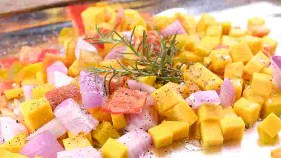 Roasted Vegetable Pasta Recipe: Place the chopped vegetables and fresh herbs on a sheet pan.