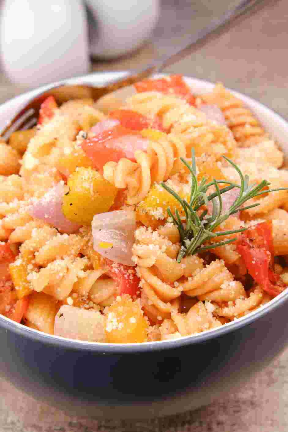 Roasted Vegetable Pasta Recipe: Top with grated Parmesan cheese and garnish with more fresh herbs if desired.