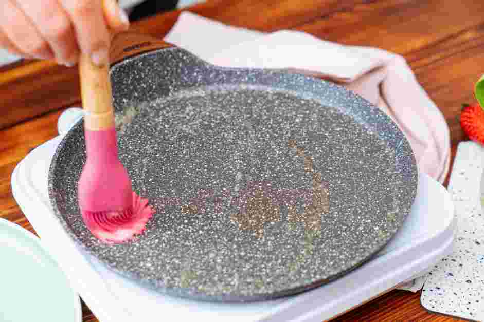 How to Make Crepes Step 5: Place an 8-inch skillet or non-stick pan on medium heat and grease it with butter.