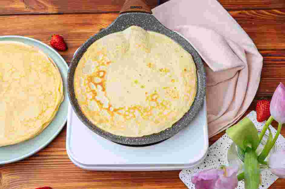 How to Make Crepes Step 7: Flip it once the bottom is set.