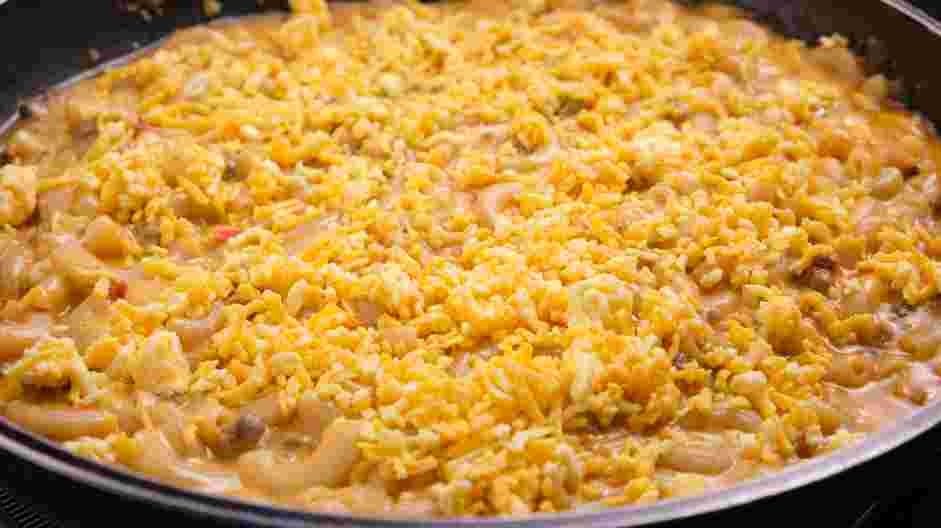 Cheeseburger Casserole Recipe: Top the casserole with the remaining mozzarella, extra sharp cheddar and Monterey Jack cheese.