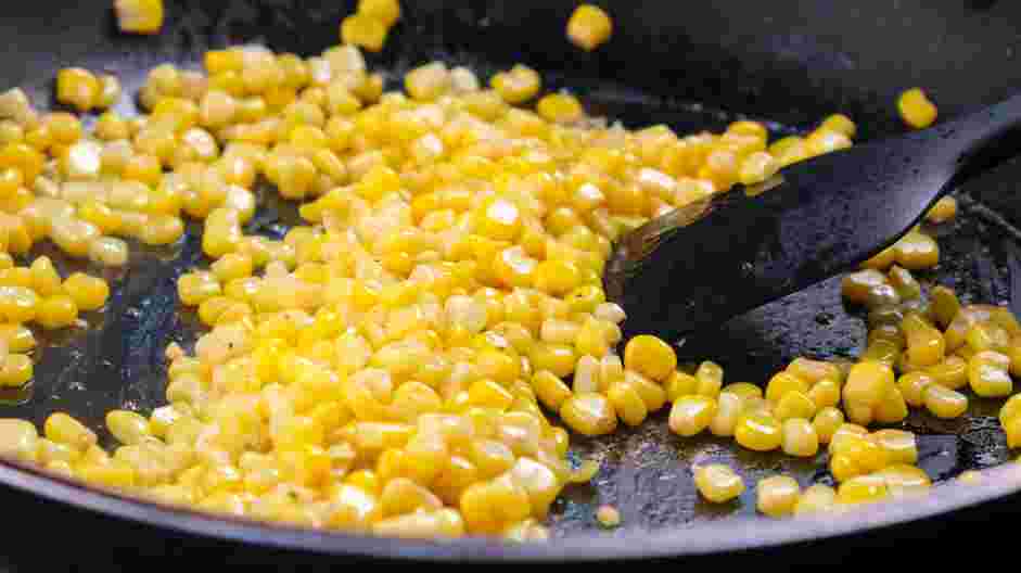 Corn Dip Recipe: In a cast-iron skillet over medium heat, add two tablespoons of butter and melt.