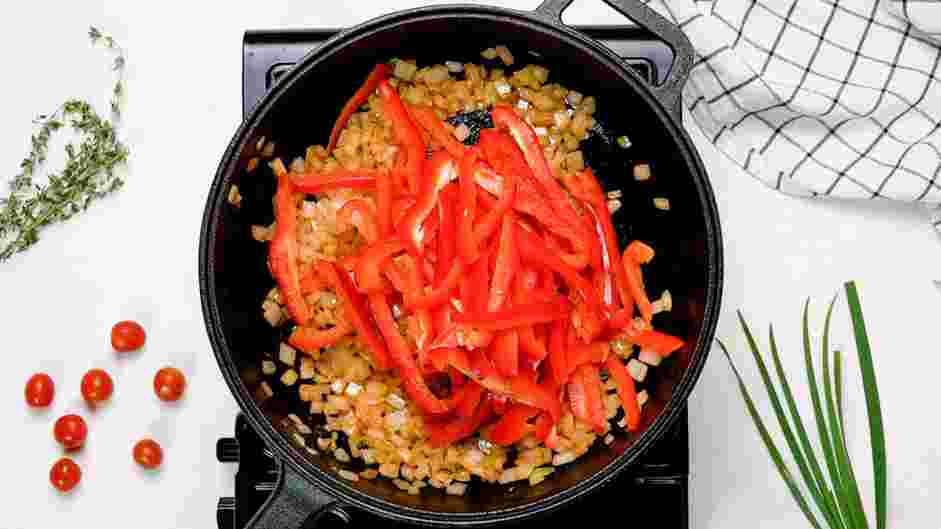 Shakshouka Recipe: When the onion turns light brown, add the sliced bell peppers.