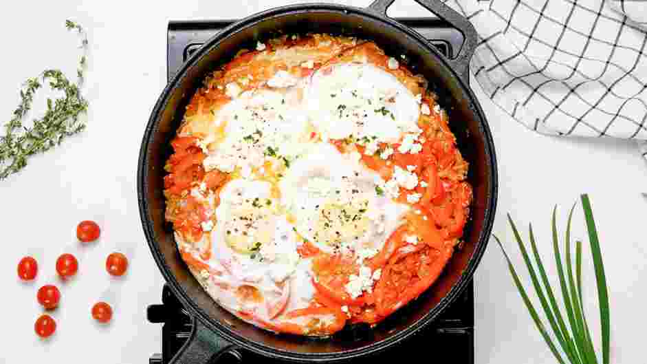 Shakshouka Recipe: Turn off the heat and sprinkle the feta cheese and the chives over the shakshouka.