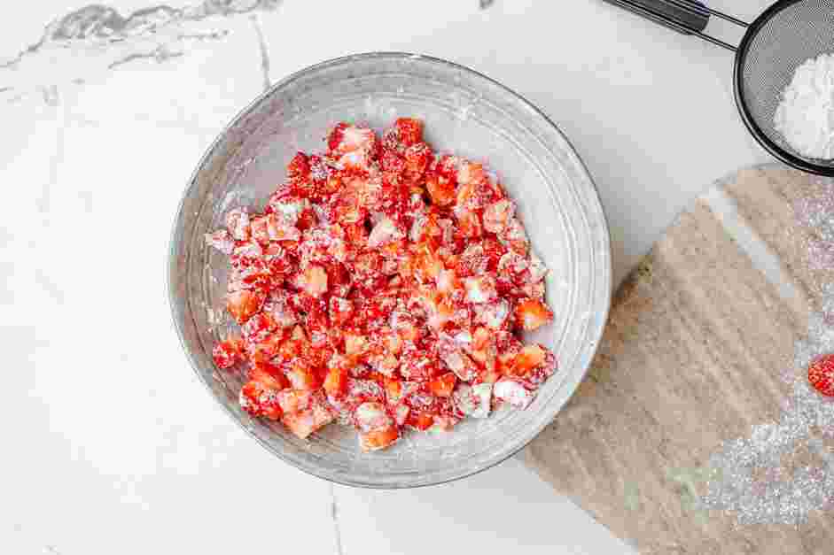 Strawberry Muffins Recipe: In a bowl, toss the strawberries with one tablespoon of the cake flour.