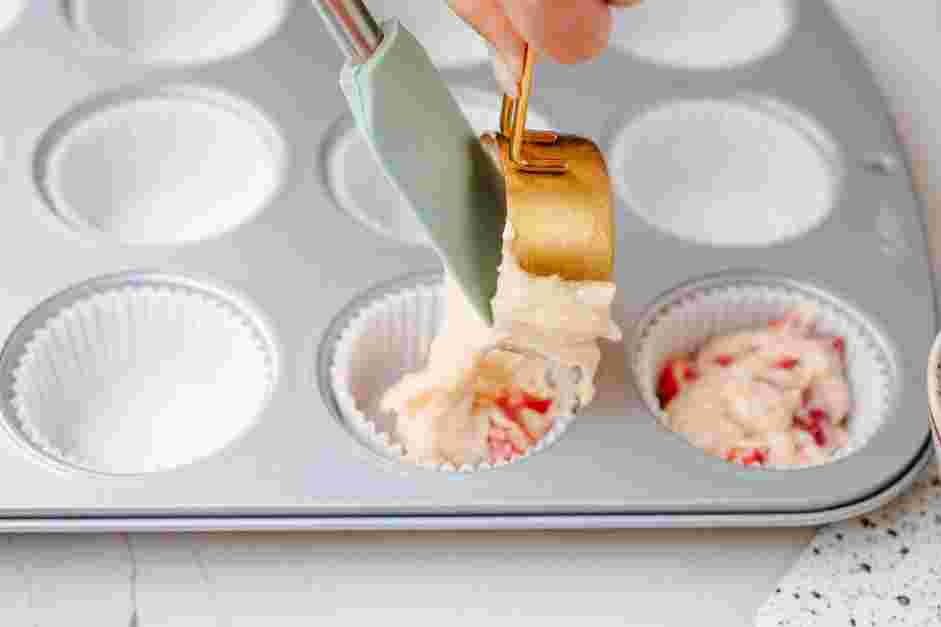 Strawberry Muffins Recipe: Use a disher or a measuring cup to add about &frac14; cup of the batter into each muffin cup.