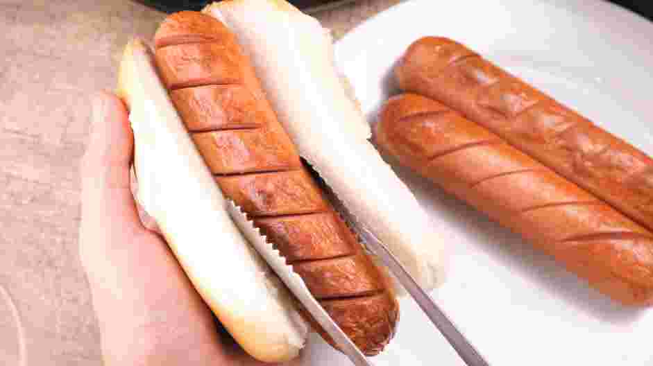 Air Fryer Hot Dogs Recipe: Place the hot dogs in hot dog buns and place them in the air fryer.