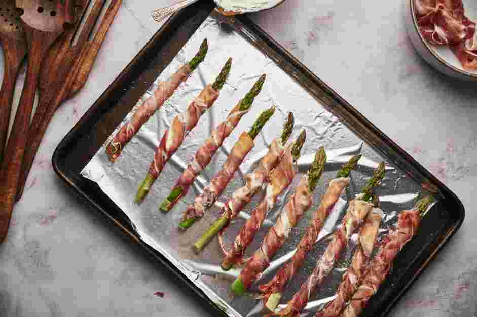 Asparagus Wrapped in Prosciutto Recipe: Place the wrapped asparagus on a foil-lined baking sheet.