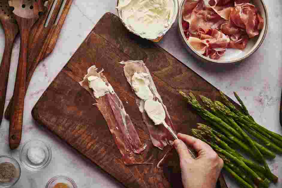 Asparagus Wrapped in Prosciutto Recipe: Spread a thin layer of softened cheese mixture on the prosciutto lengths carefully, to keep the piece intact.