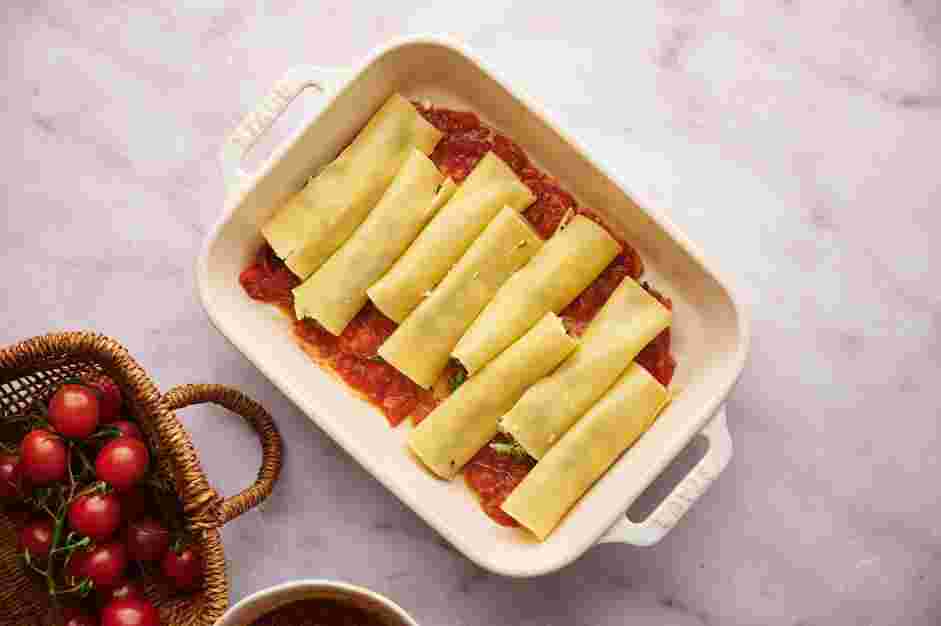 Baked Manicotti with Marinara Sauce Recipe: Spoon some marinara sauce into the baking dish and spread to cover the bottom of the dish.