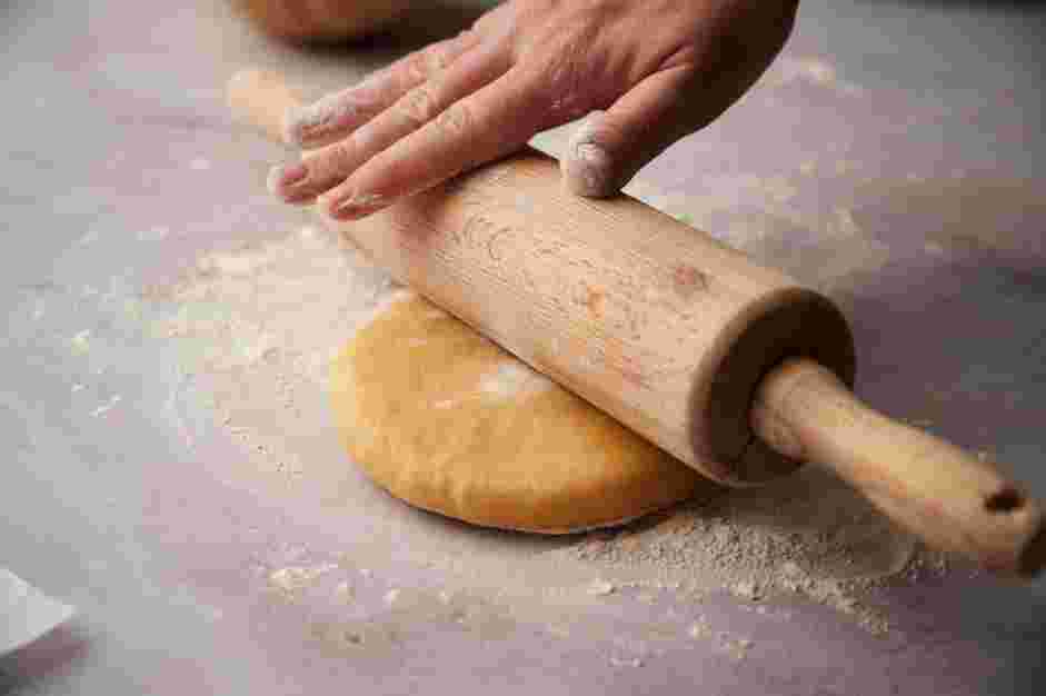 Tequenos Recipe: When the dough is done resting, place the dough on a lightly floured work surface and lightly dust with additional flour on top of the dough to prevent sticking.