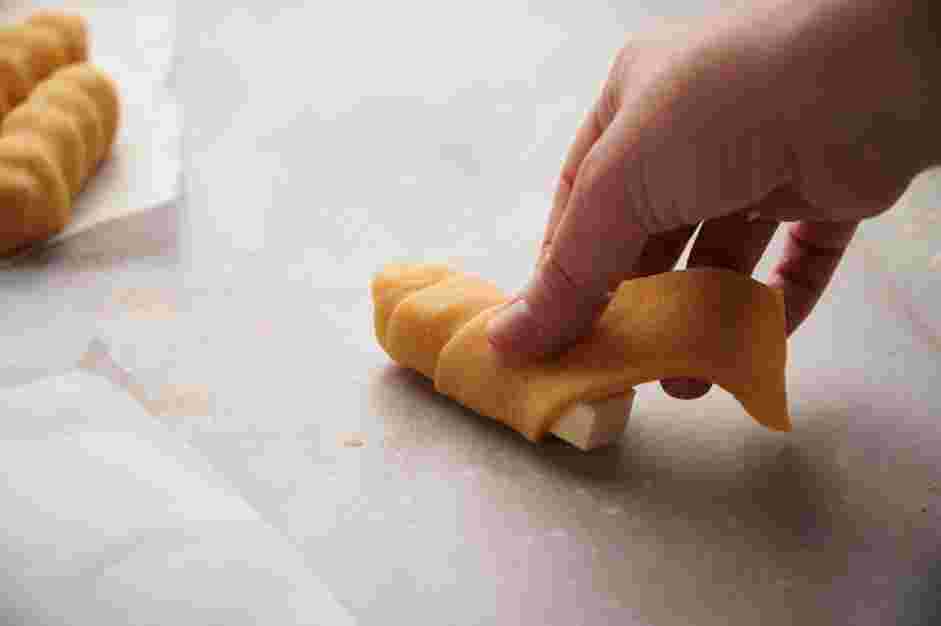 Tequenos Recipe: Use a paper towel to blot off any extra moisture from the cheese.