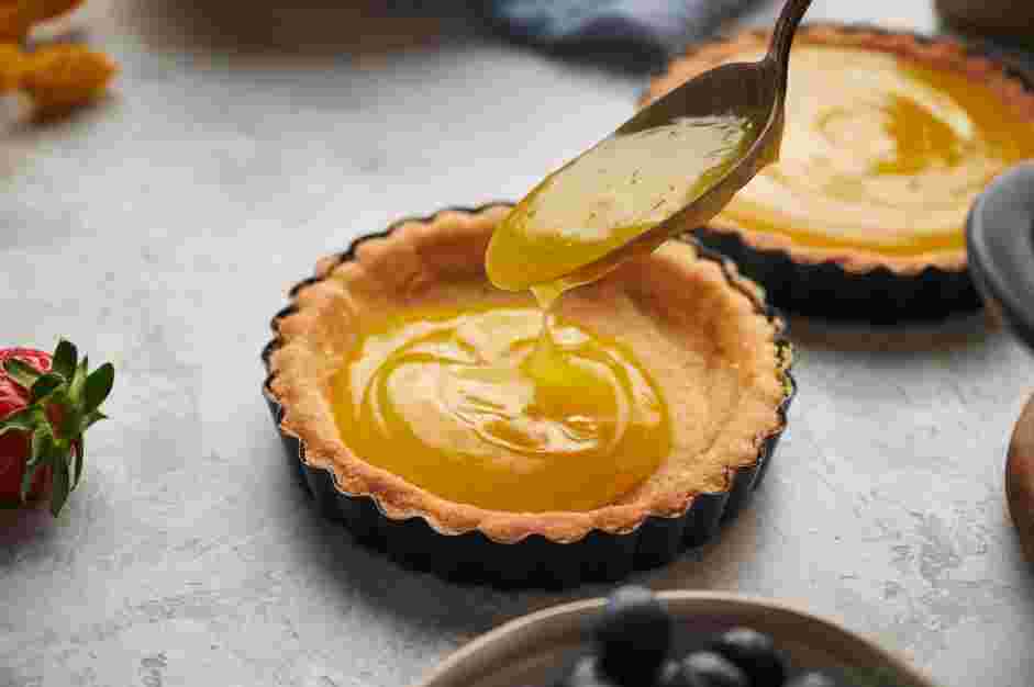 Lemon Curd Tart Recipe: Pour the lemon curd into the prepared crusts.